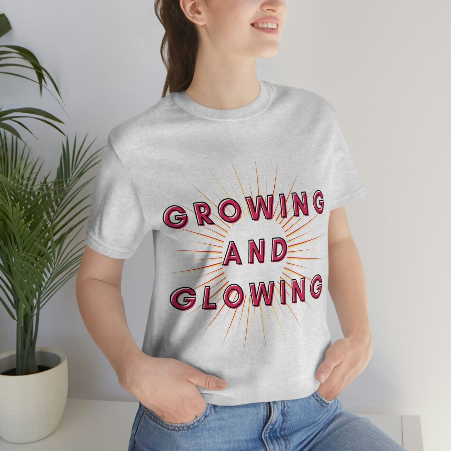 Growing And Glowing ( Graphic Pink And White Text Sun Burst ) Unisex Jersey Short Sleeve Tee - Style: Bella+Canvas 3001