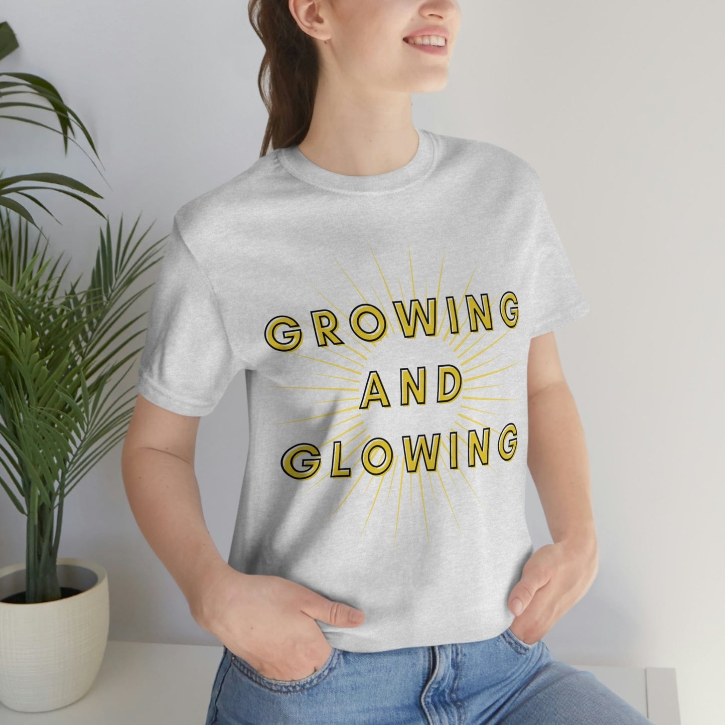 Growing And Glowing  ( Graphic Yellow and Black Text Sun Burst ) Unisex Jersey Short Sleeve Tee - Style: Bella+Canvas 3001